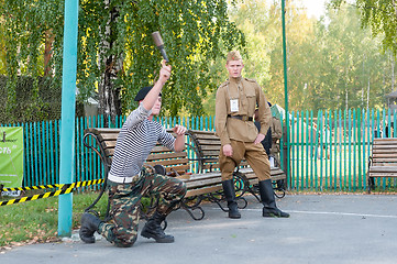 Image showing Boy throws hand grenade