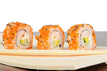 Image showing Closeup of three California maki sushi in row