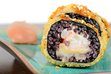 Image showing Baked sushi rolls served on turquoise plate