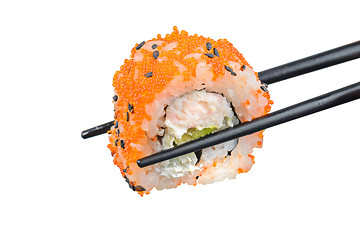 Image showing Sushi roll with black chopsticks 