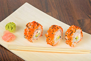 Image showing Closeup California maki sushi in row ot the table