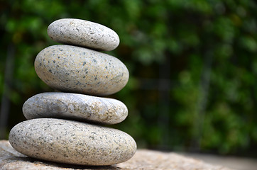 Image showing Stack of zen rocks in garden