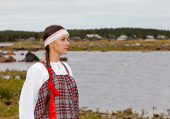 Image showing girl in national dress at the sea shore
