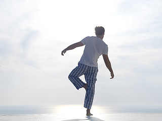 Image showing young man practicing yoga