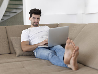 Image showing Man Relaxing On Sofa With Laptop