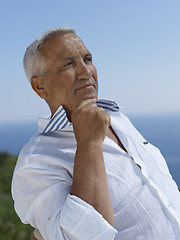 Image showing senior man sitting outside