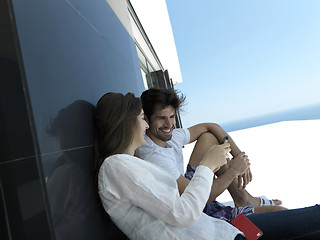 Image showing young couple making selfie together at home