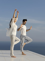 Image showing young couple practicing yoga