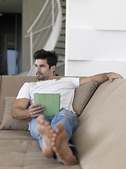 Image showing man using tablet computer from home