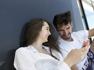 Image showing young couple making selfie together at home