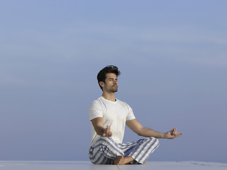 Image showing young man practicing yoga