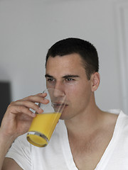 Image showing man having orange juice