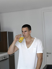 Image showing man having orange juice