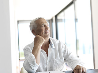 Image showing Portrait of senior man relaxing in sofa