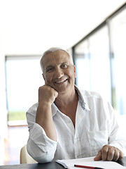 Image showing Portrait of senior man relaxing in sofa