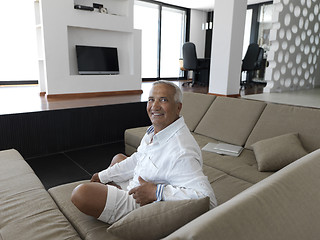 Image showing Portrait of senior man relaxing in sofa