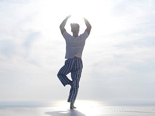 Image showing young man practicing yoga