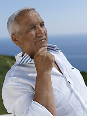 Image showing senior man sitting outside