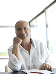 Image showing Portrait of senior man relaxing in sofa