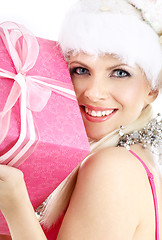 Image showing santa helper girl with pink gift box