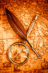 Image showing Vintage still life. Vintage items on ancient map.