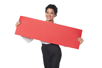 Image showing Happy businesswoman holding banner