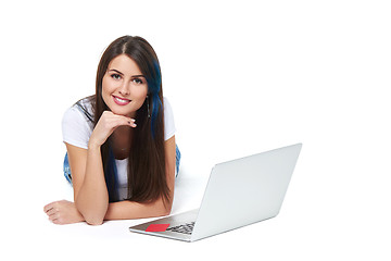 Image showing Woman lying on the floor with laptop