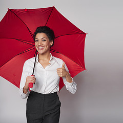 Image showing Happy woman with umbrella