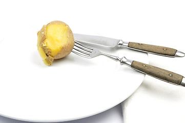 Image showing Potato peeling on table