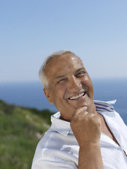 Image showing senior man sitting outside