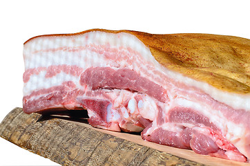 Image showing A piece of bacon in a cut on a wooden board