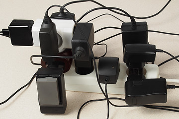 Image showing Battery chargers and extension cord