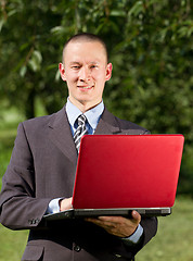 Image showing Man working outdoors as a freelancer