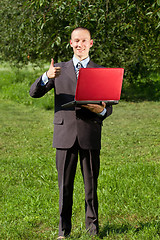 Image showing Man working outdoors as a freelancer