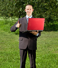 Image showing Man working outdoors as a freelancer