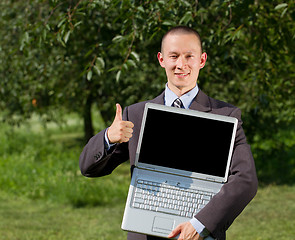 Image showing Man working outdoors as a freelancer