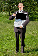 Image showing Man working outdoors as a freelancer