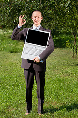 Image showing Man working outdoors as a freelancer