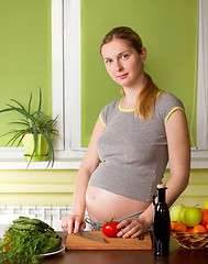 Image showing Pregnant woman on kitchen cooking