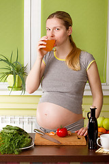 Image showing Pregnant woman on kitchen cooking