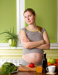 Image showing Pregnant woman on kitchen cooking