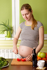 Image showing Pregnant woman on kitchen cooking