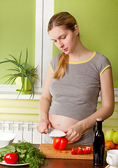 Image showing Pregnant woman on kitchen cooking