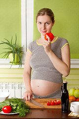 Image showing Pregnant woman on kitchen cooking