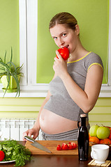 Image showing Pregnant woman on kitchen cooking