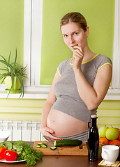 Image showing Pregnant woman on kitchen cooking