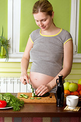 Image showing Pregnant woman on kitchen cooking