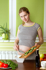 Image showing Pregnant woman on kitchen cooking