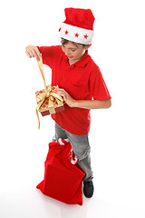 Image showing Boy opening Christmas present