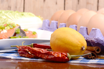 Image showing lemon, eggs, red fish, cabbage and red pepper